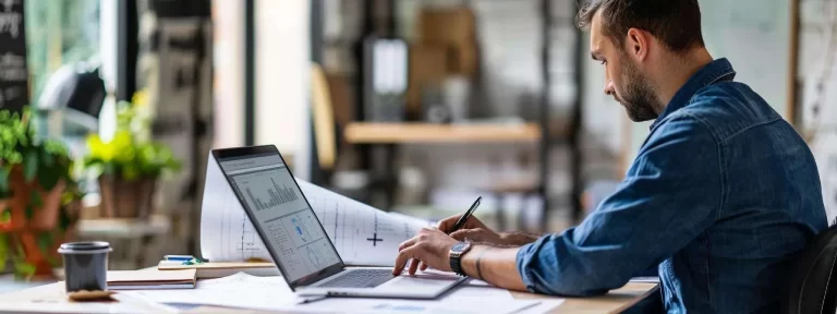 Professional businessman reviewing legal documentation on laptop showing favorable lawsuit outcome